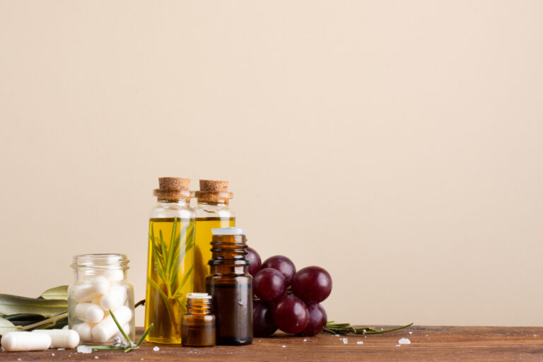 close-up-bottles-with-oil-pills-table